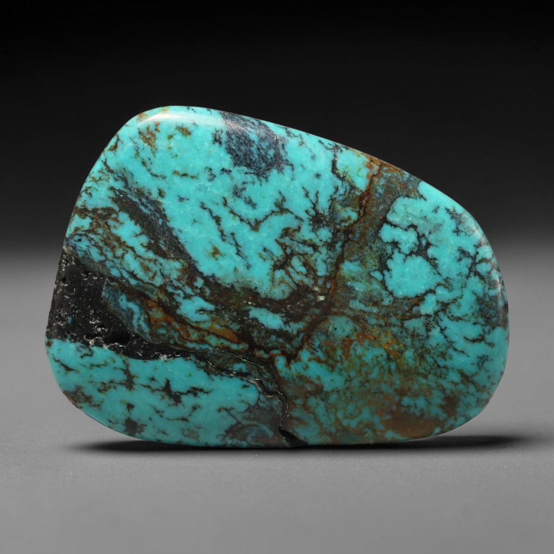 Vintage Tibetan Natural Turquoise Cabochon Loose Gemstone, 73BW: Polished vintage Tibetan turquoise freeform cabochon loose gemstone, measuring 34x25 mm. Features characteristic natural matrix webbing and earthy mineral markings inherent to authentic Tibetan turquo