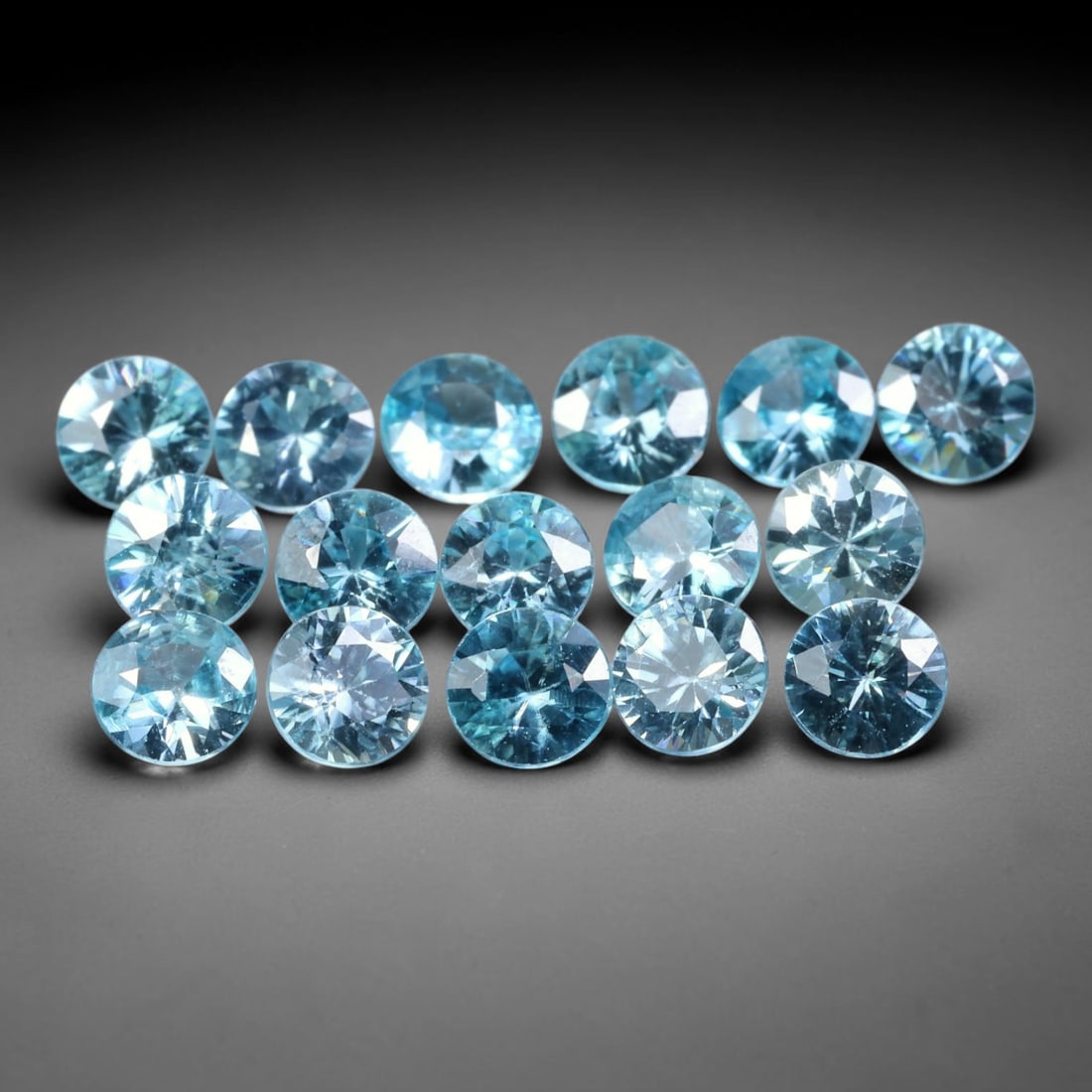 5.62ct Parcel of 16pcs Natural Brazilian Calibrated Round Sky Blue Topaz Loose Gemstones, 32BE: This matched parcel contains sixteen polished calibrated round topaz displaying clean bright sky-blue hue, with faint minor natural internal crystal features within each gemstone, uniform calibrated s