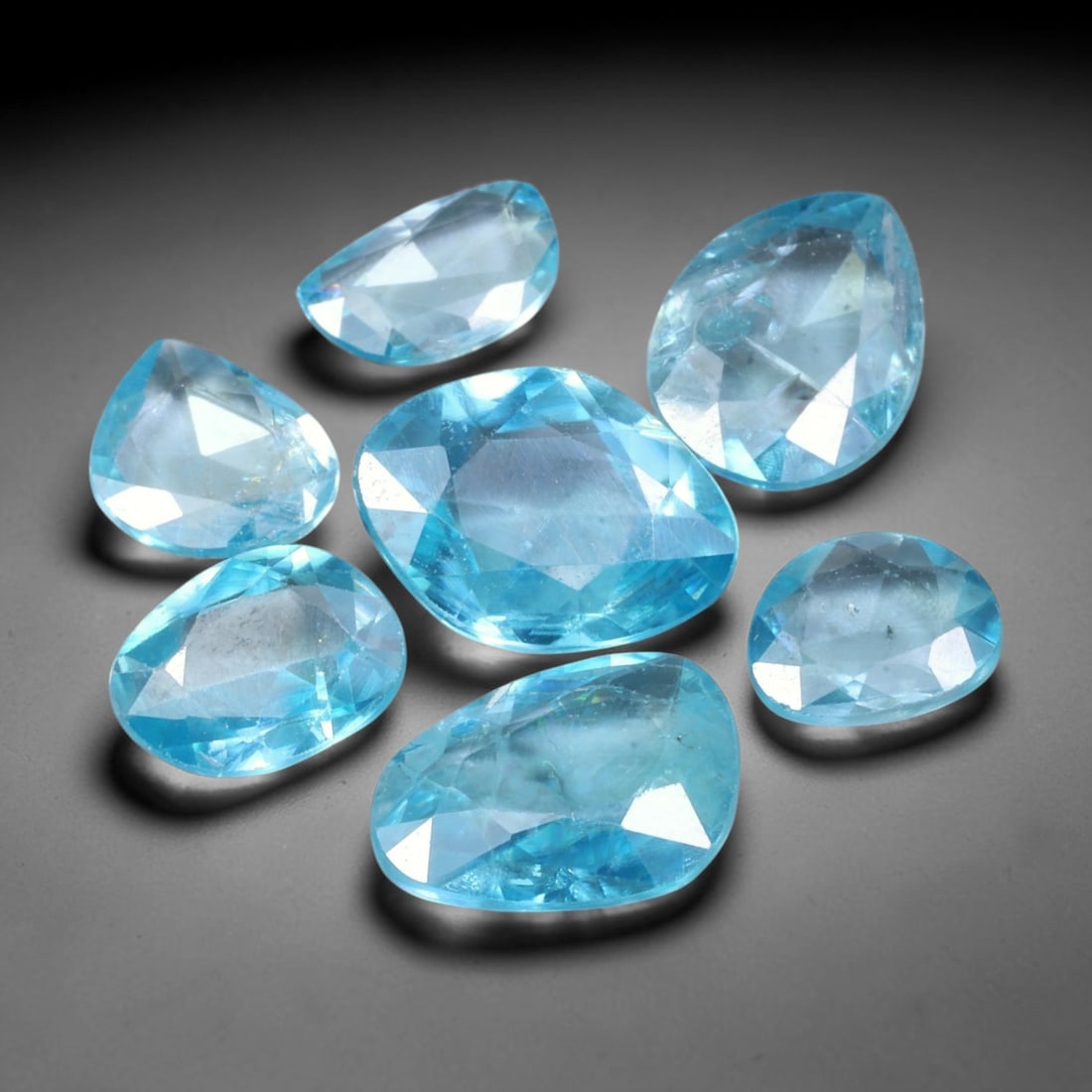 19.15ct Natural Cambodian Rose Cut Blue Zircon Loose Gemstone Parcel Lot, 14EV: This attractive parcel of rose-cut blue zircon features cool aquatic blue tones paired with flat-backed rose cut faceting, creating soft diffused sparkle and dreamy translucent visual effect. Varied f
