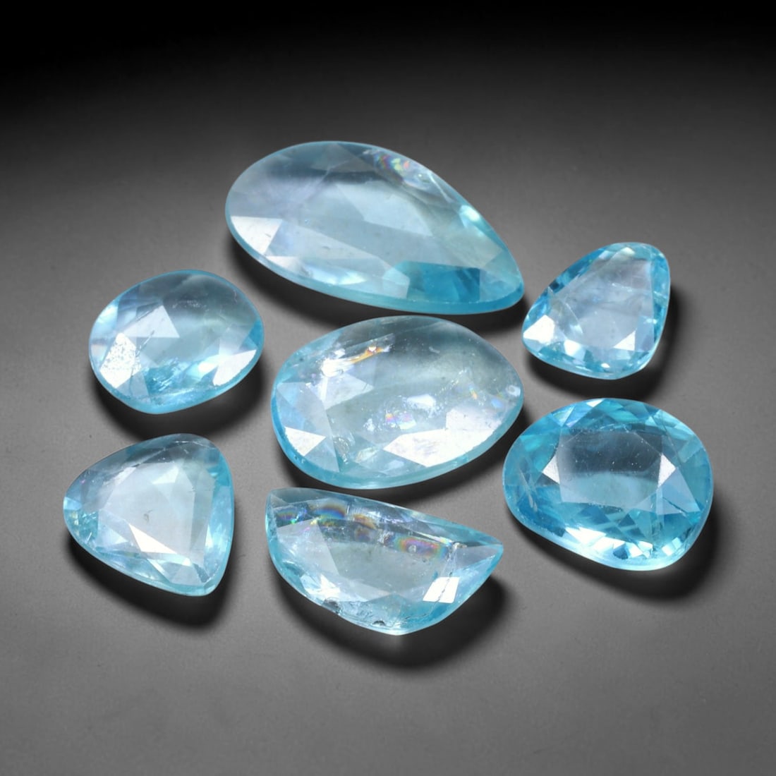 18.91ct Natural Cambodian Rose Cut Blue Zircon Loose Gemstone Parcel Lot, 11EV: This attractive parcel of rose-cut blue zircon features cool aquatic blue tones paired with flat-backed rose cut faceting, creating soft diffused sparkle and dreamy translucent visual effect. Varied f