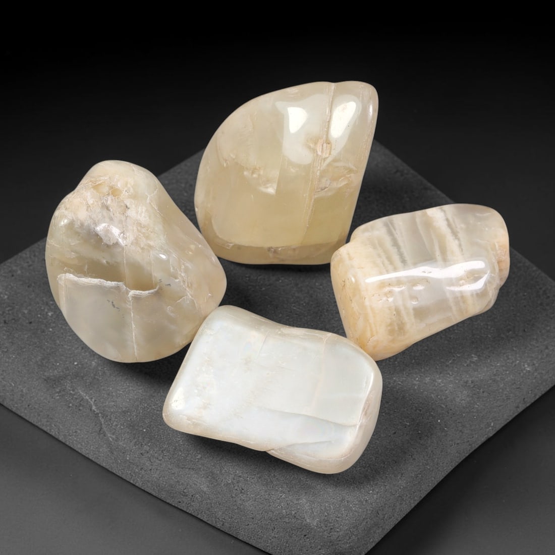 267ct Natural Ceylon Moonstone Tumbled Rough Parcel Lot, 4EW: This parcel features naturally tumbled Ceylon moonstone rough displaying soft creamy pale-hued translucent bodies with natural internal fractures and textural layering. Smooth water-worn surfaces show