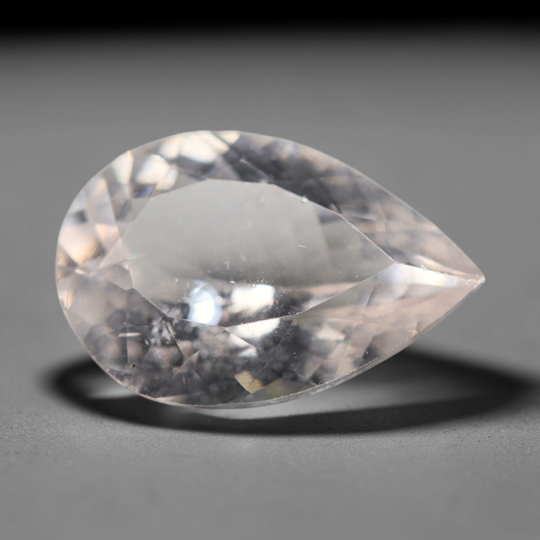 4.63ct Natural Brazilian Morganite Pear Faceted Loose Gemstone, 80BZ: This elegantly shaped pear faceted gemstone is natural morganite sourced from Brazil. It carries a soft pale pastel pink tone within its transparent crystal matrix, with precisely crafted facets that 