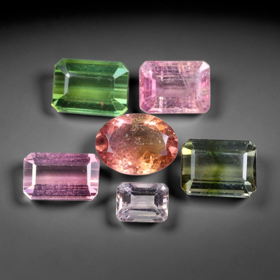 6.89ct Natural Mozambican Fancy Tourmaline Loose Gemstone Parcel Lot, 16EW: This colourful parcel of fancy tourmaline presents a vibrant spectrum of tones, including pastel mint-green, deep teal-blue, soft rose-pink and striking bi-colour saturation across mixed emerald-cut a