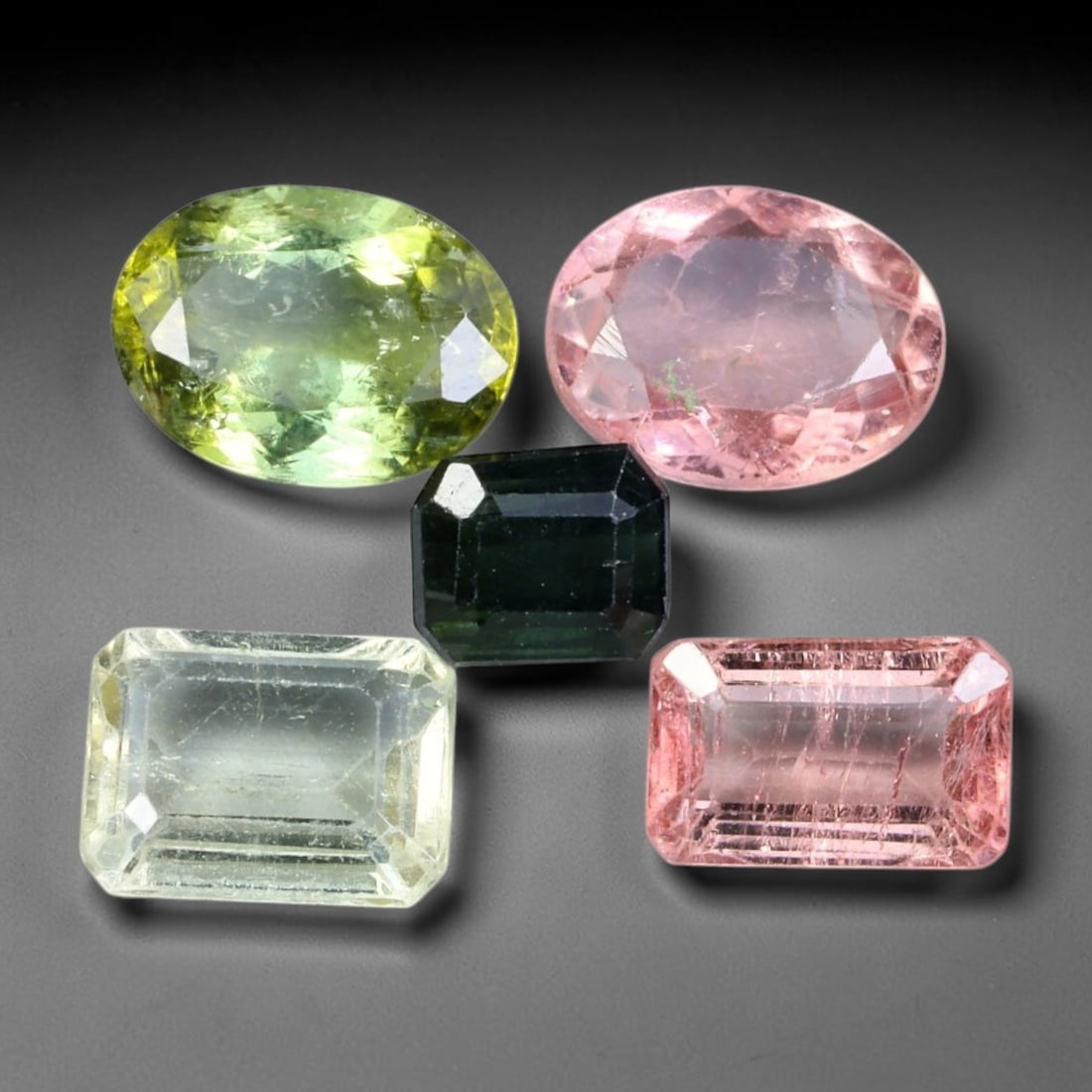 6.68ct Natural Mozambican Fancy Tourmaline Loose Gemstone Parcel Lot, 9EW: This colourful parcel of fancy tourmaline presents a vibrant spectrum of tones, including pastel mint-green, deep teal-blue, soft rose-pink and striking bi-colour saturation across mixed emerald-cut a