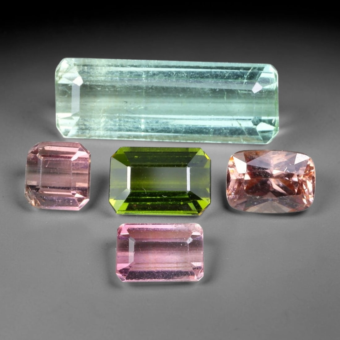 7.79ct Natural Mozambican Fancy Tourmaline Loose Gemstone Parcel Lot, 10EW: This colourful parcel of fancy tourmaline presents a vibrant spectrum of tones, including pastel mint-green, deep teal-blue, soft rose-pink and striking bi-colour saturation across mixed emerald-cut a
