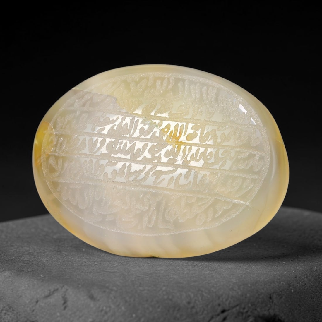 Ancient Medieval Mughal Islamic Carnelian Agate Calligraphic Script Talisman 1526-1857 CE, 77ES: Polished rich-toned carnelian agate cabochon, finely engraved with divided panels of Islamic calligraphic intaglio inscriptions. Deep crisp engraving features segmenting incised lines organizing the s