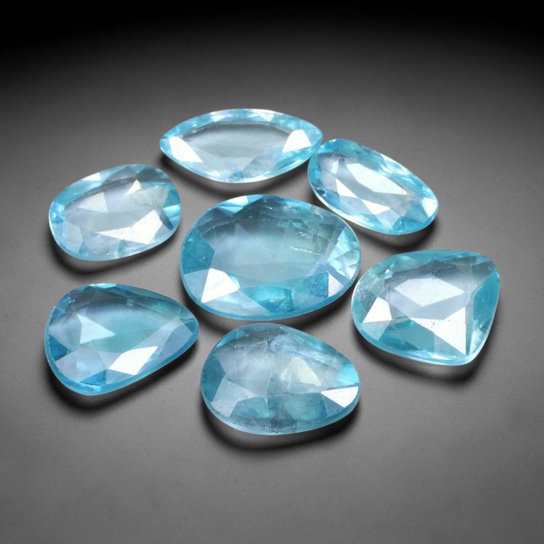 12.93ct Natural Cambodian Rose Cut Blue Zircon Loose Gemstone Parcel Lot, 16EV: This attractive parcel of rose-cut blue zircon features cool aquatic blue tones paired with flat-backed rose cut faceting, creating soft diffused sparkle and dreamy translucent visual effect. Varied f
