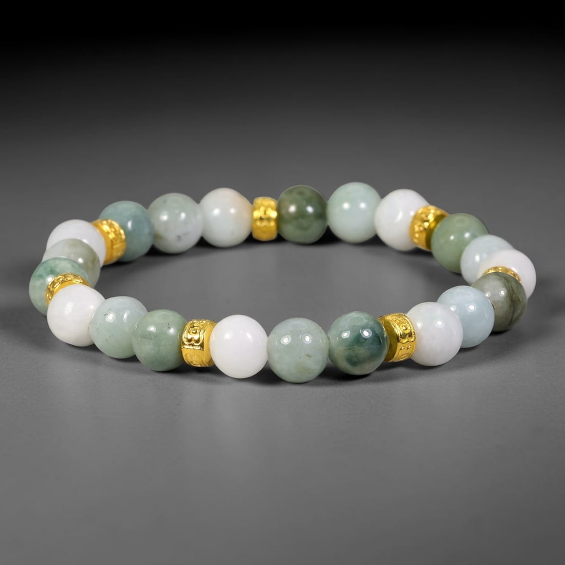 Natural Burmese Type A Jadeite Jade Beaded Bracelet, 25FJ: Constructed from polished natural jadeite jade round beads paired with decorative accent elements. The bracelet measures 8cm, assembled as a flexible wearable strand. Simple and elegant, suitable for 