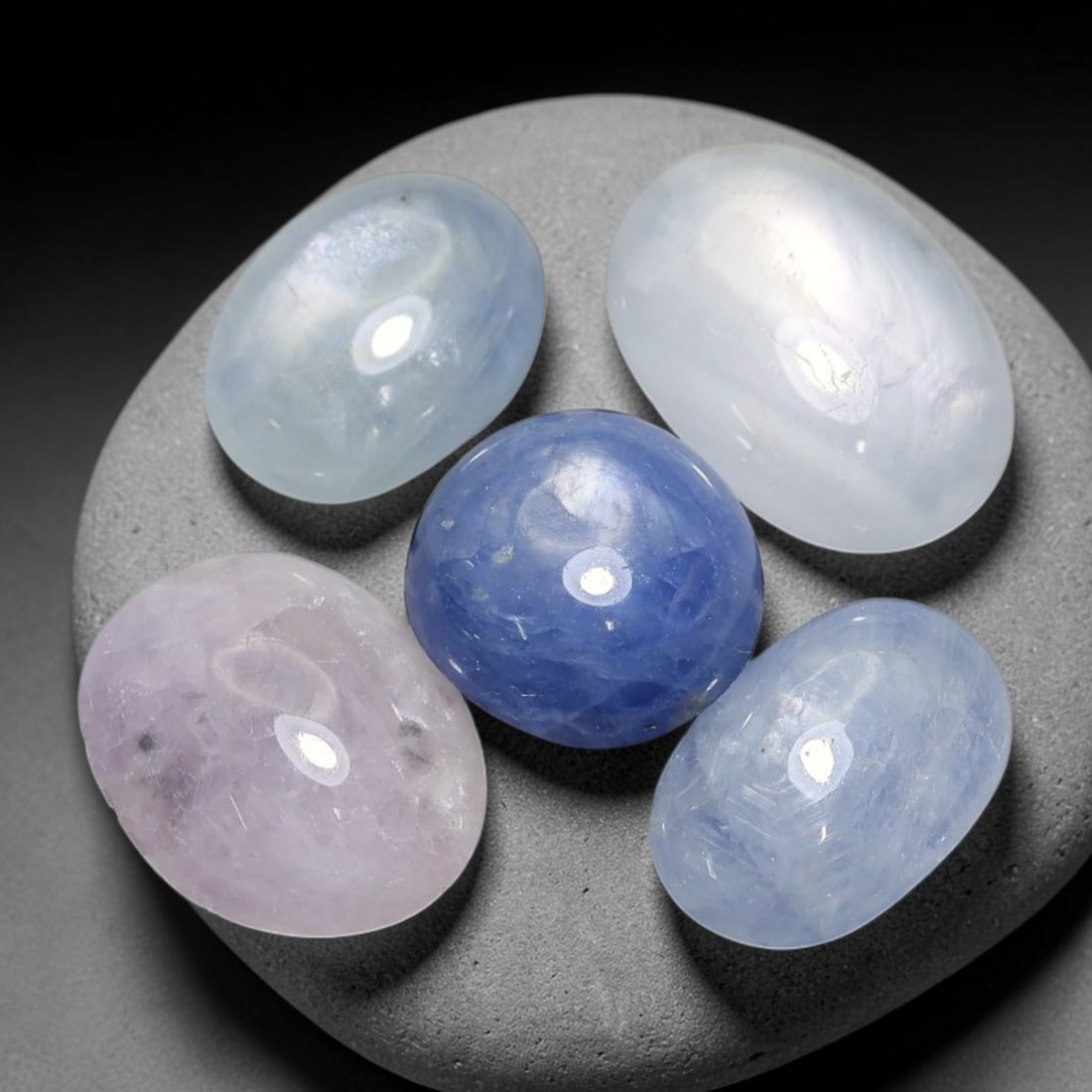 21.30ct Natural Unheated Burmese Star Sapphire Loose Gemstone Parcel Lot, 27EX: This parcel contains natural unheated star sapphire originating from Myanmar. The gem material displays soft pale blue and lavender hues, with characteristic silk inclusions that create the desirable 