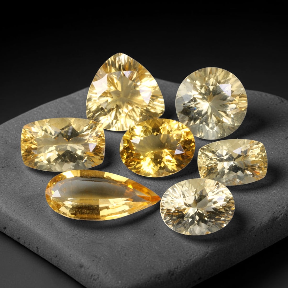 29.14ct Natural Brazilian Citrine Faceted Parcel Lot, 31EX: This faceted parcel includes mixed-shape finished citrine gemstones featuring soft pale golden-yellow tones across cushion, pear, round and triangular cuts. Precision faceting produces bright sparkle 