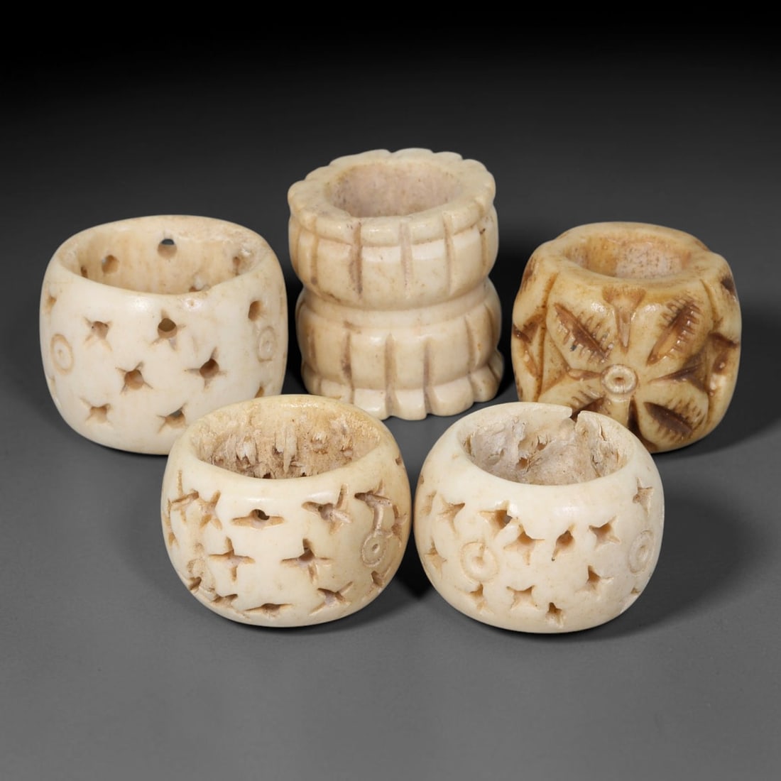 Antique Sino-Siberian Steppe Nomadic Stag Antler Carved Beads Parcel Lot, 34EY: Group of antique post-1850s Sino-Siberian steppe nomadic craft stag antler carved beads, each with fully drilled central bore for threading. Surfaces feature varied incised decorative motifs including