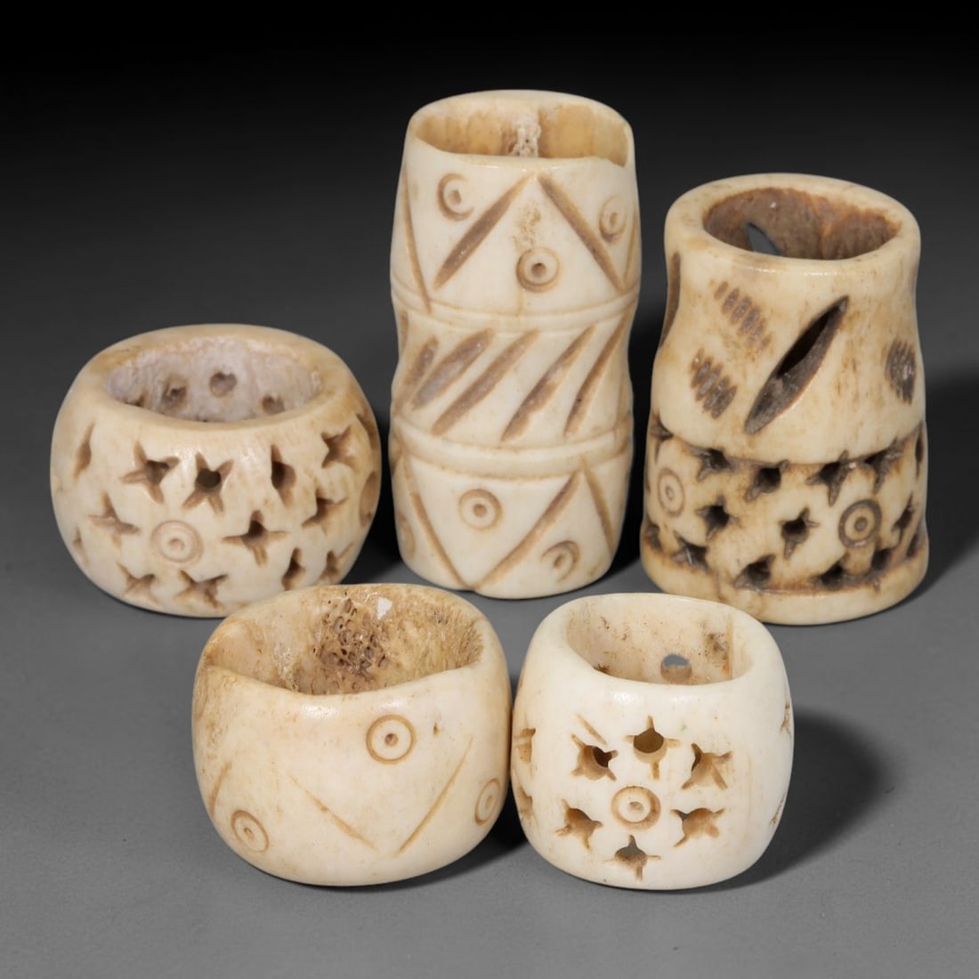 Antique Sino-Siberian Steppe Nomadic Stag Antler Carved Beads Parcel Lot, 35EY: Group of antique post-1850s Sino-Siberian steppe nomadic craft stag antler carved beads, each with fully drilled central bore for threading. Surfaces feature varied incised decorative motifs including