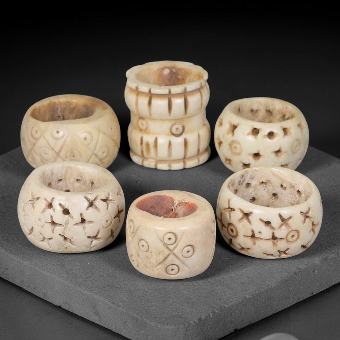 Antique Sino-Siberian Steppe Nomadic Stag Antler Carved Beads Parcel Lot, 33EY: Group of antique post-1850s Sino-Siberian steppe nomadic craft stag antler carved beads, each with fully drilled central bore for threading. Surfaces feature varied incised decorative motifs including