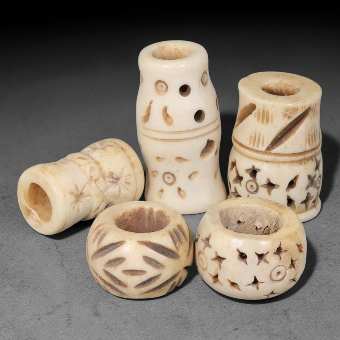 Antique Sino-Siberian Steppe Nomadic Stag Antler Carved Beads Parcel Lot, 26EY: Group of antique post-1850s Sino-Siberian steppe nomadic craft stag antler carved beads, each with fully drilled central bore for threading. Surfaces feature varied incised decorative motifs including