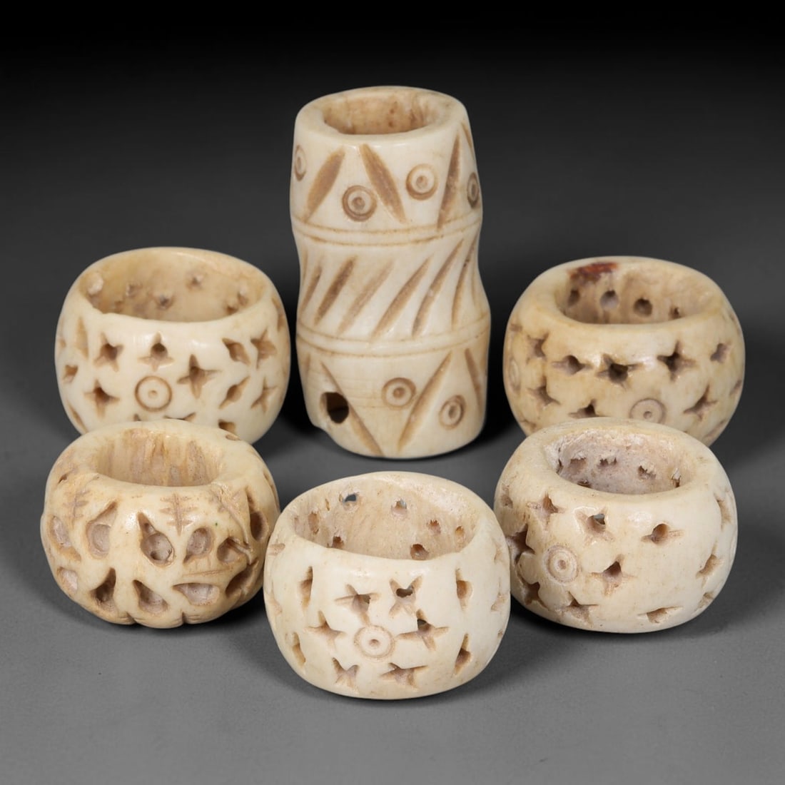 Antique Sino-Siberian Steppe Nomadic Stag Antler Carved Beads Parcel Lot, 32EY: Group of antique post-1850s Sino-Siberian steppe nomadic craft stag antler carved beads, each with fully drilled central bore for threading. Surfaces feature varied incised decorative motifs including