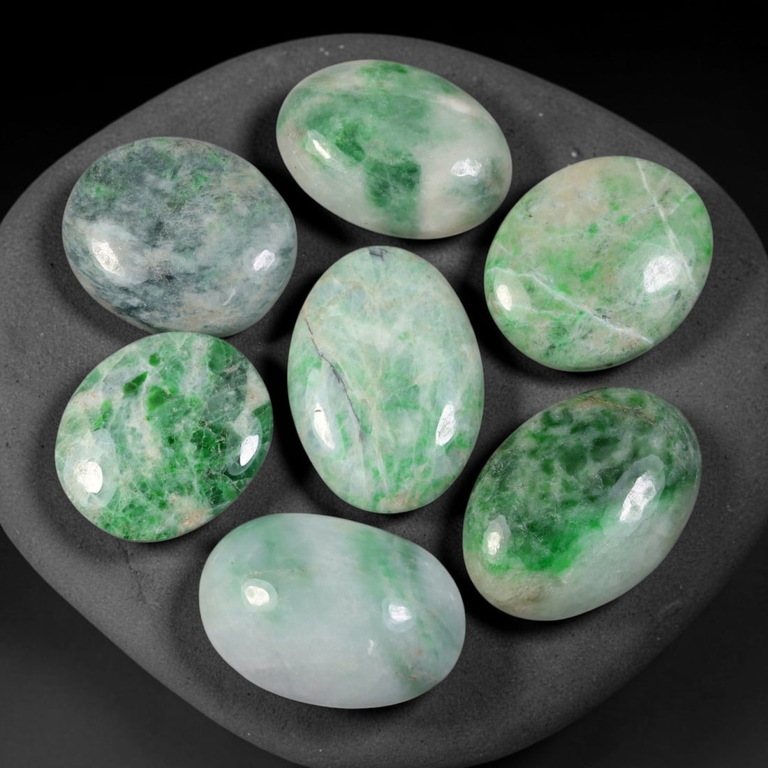 173.78ct Natural Burmese Type A Jadeite Jade Cabochon Parcel Lot, 93EY: This polished oval cabochon parcel displays natural Type A burmese jadeite jade with broad colour variation. High gloss polished domed surfaces reveal natural internal crystalline textures, mineral ve