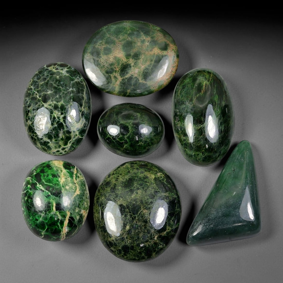 192.30ct Natural Burmese Type A Jadeite Jade Cabochon Parcel Lot, 91EY: This polished oval cabochon parcel displays natural Type A burmese jadeite jade with broad colour variation. High gloss polished domed surfaces reveal natural internal crystalline textures, mineral ve
