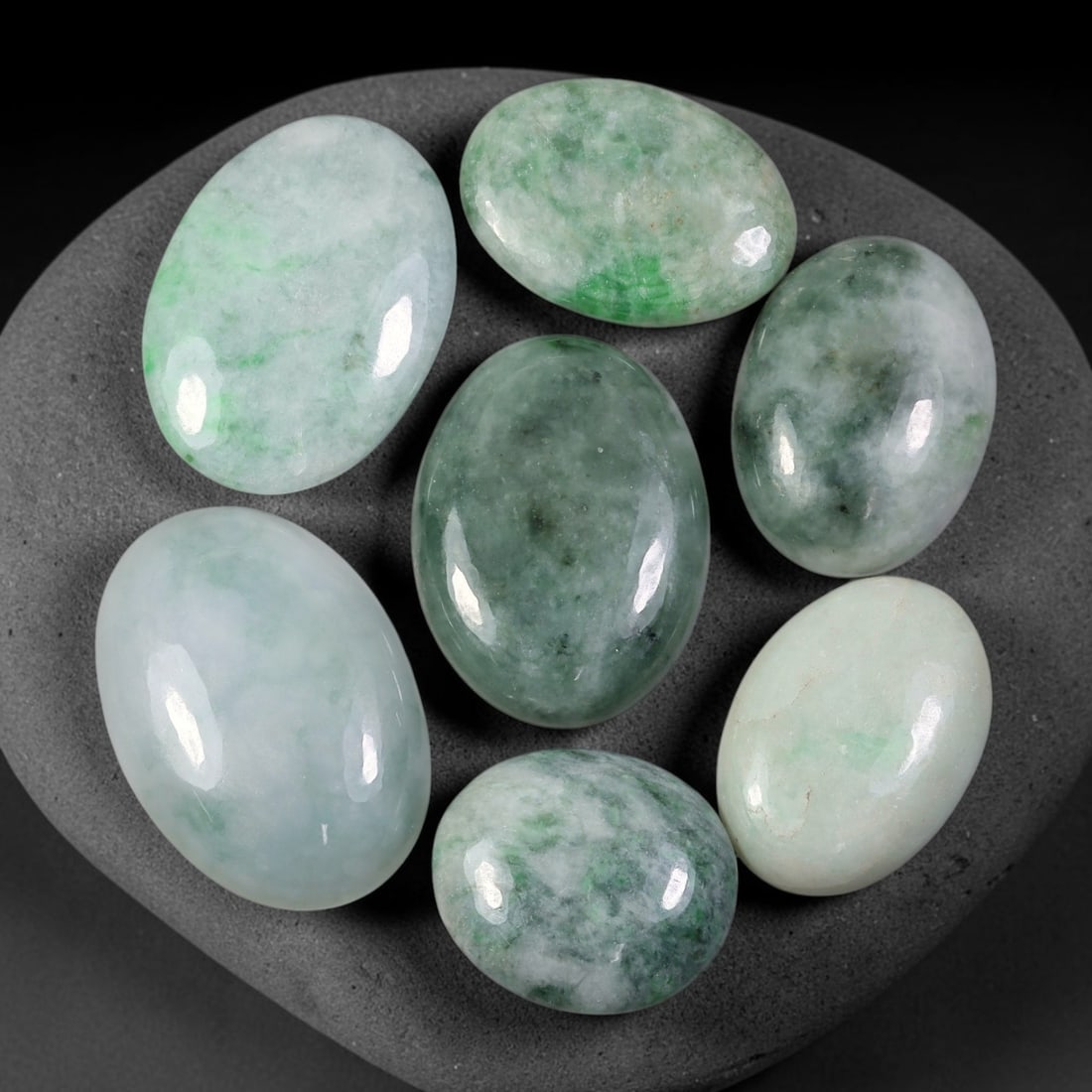211.54ct Natural Burmese Type A Jadeite Jade Cabochon Parcel Lot, 100EY: This polished oval cabochon parcel displays natural Type A burmese jadeite jade with broad colour variation. High gloss polished domed surfaces reveal natural internal crystalline textures, mineral ve