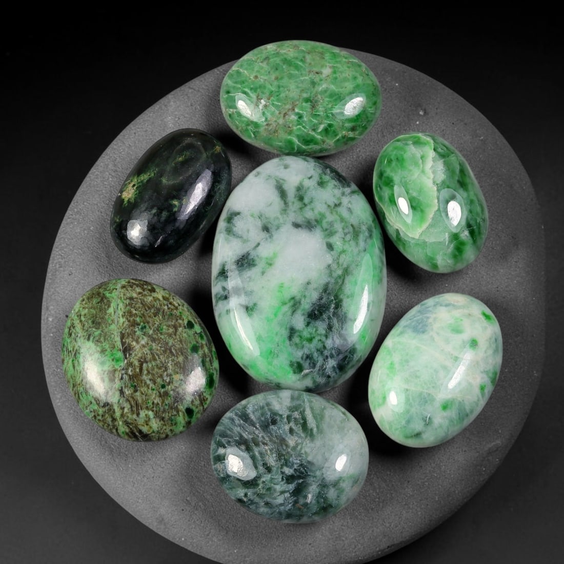 151.67ct Natural Burmese Type A Jadeite Jade Cabochon Parcel Lot, 90EY: This polished oval cabochon parcel displays natural Type A burmese jadeite jade with broad colour variation. High gloss polished domed surfaces reveal natural internal crystalline textures, mineral ve