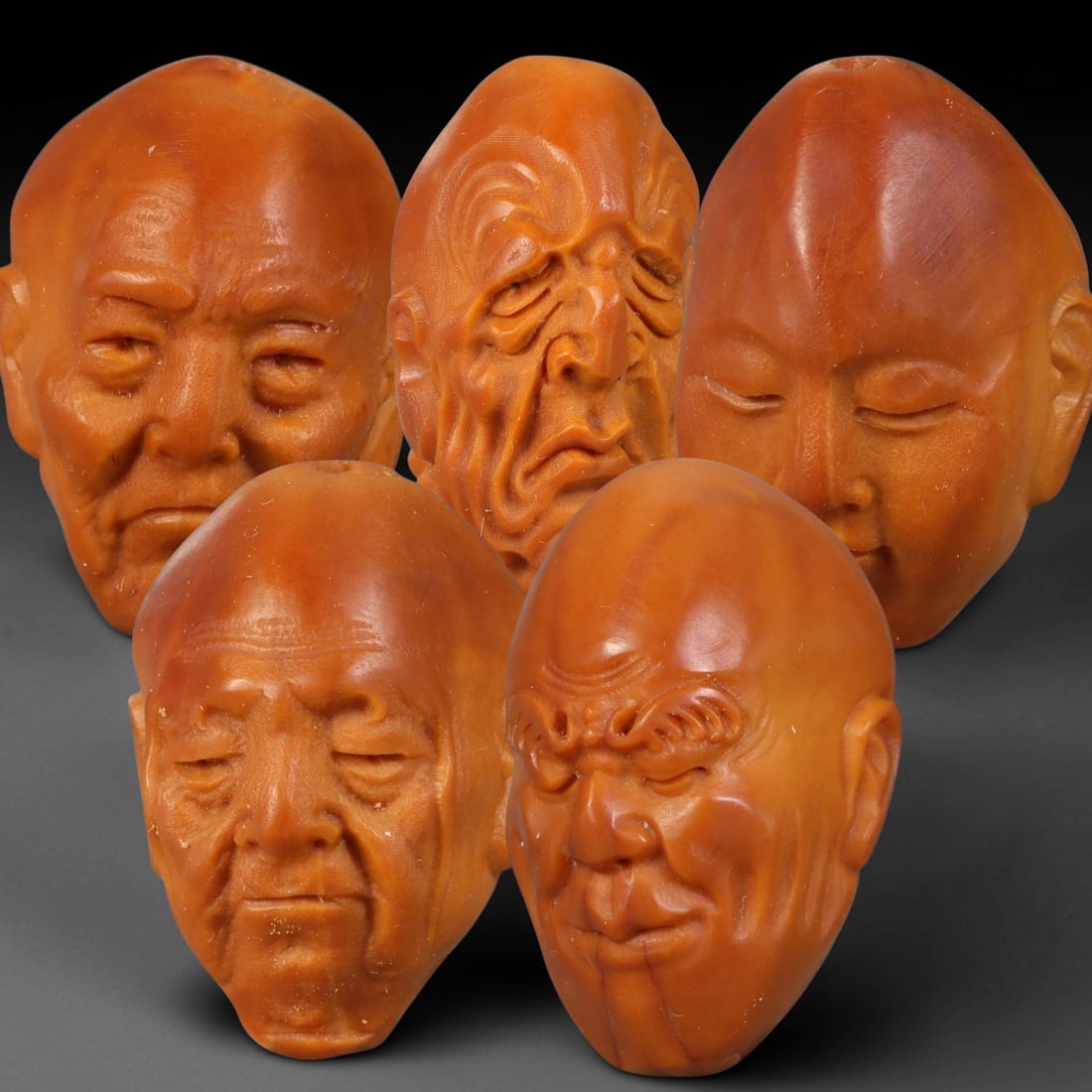 Chinese Carved Natural Olive Nut Drilled Art Bead Parcel Lot, 39BC: Set of Chinese natural olive nut carved beads, each deeply sculpted with expressive facial forms and fully centre-drilled for threading. Warm natural aged nut patina and fine surface carving detail th