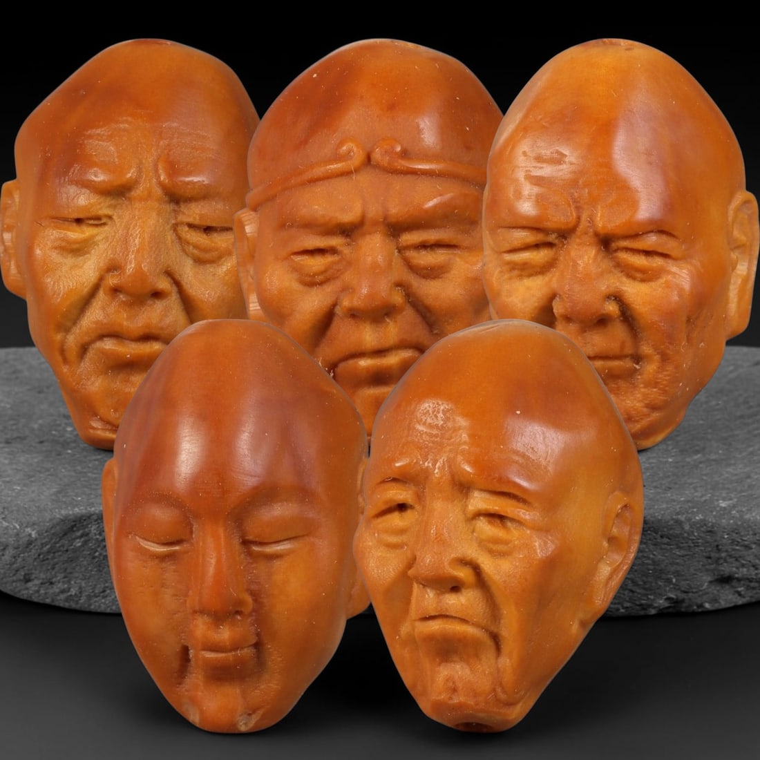 Chinese Carved Natural Olive Nut Drilled Art Bead Parcel Lot, 38BC: Set of Chinese natural olive nut carved beads, each deeply sculpted with expressive facial forms and fully centre-drilled for threading. Warm natural aged nut patina and fine surface carving detail th