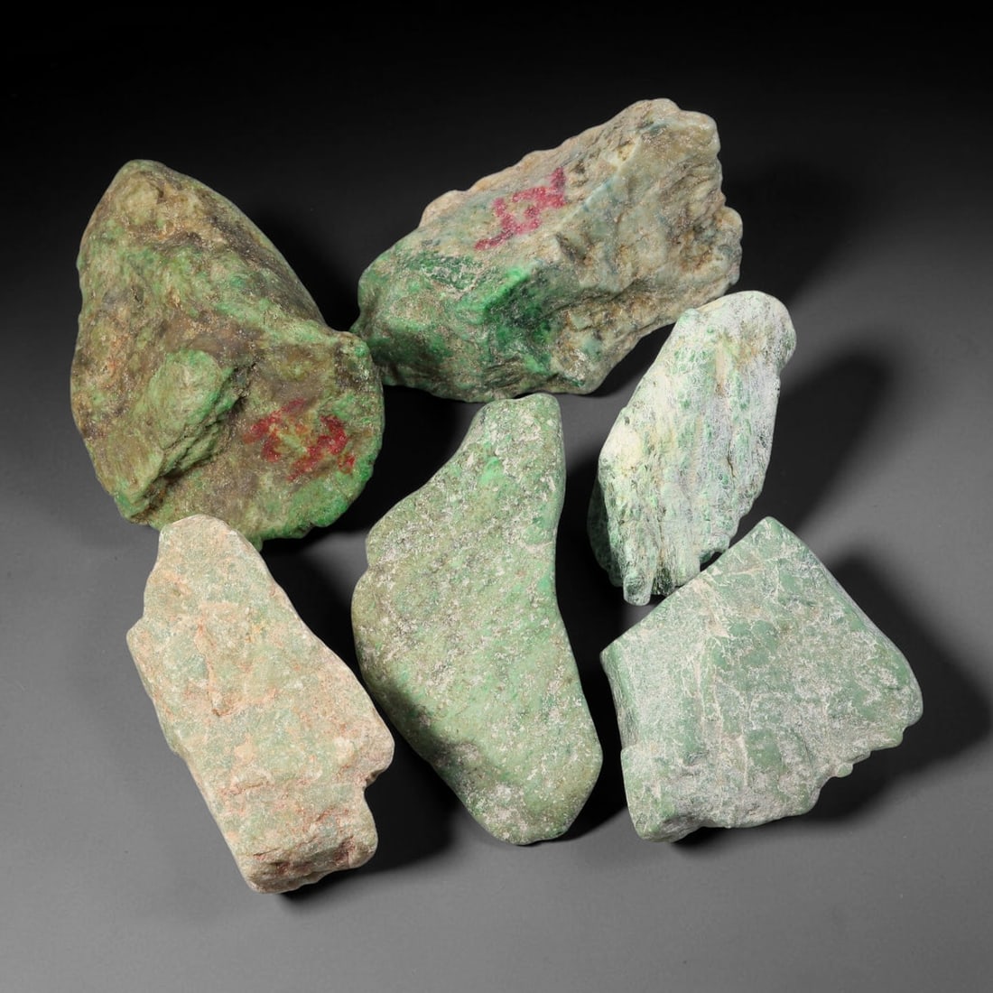 945ct Natural Burmese Type A Jadeite Jade Rough Parcel Lot, 21BC: This rough parcel includes mixed unpolished and partially sawn Type A burmese jadeite jade chunks. Specimens exhibit varied visual features including bright patchy green mottling, pale celadon-green, 