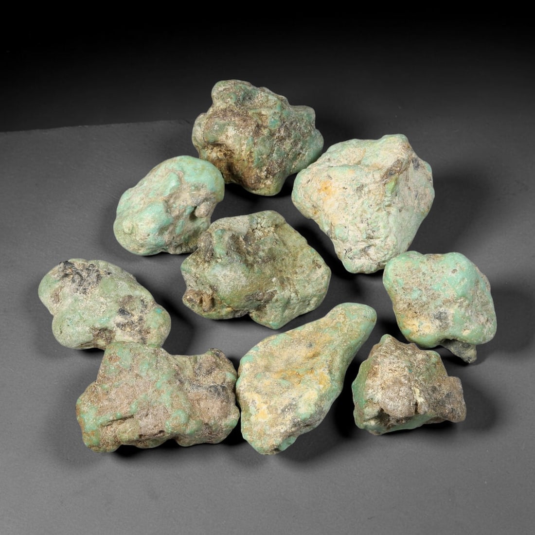430ct Natural Arizona Kingman Turquoise Nugget Rough Stone Parcel Lot, 30BC: This parcel consists of natural unpolished Kingman turquoise nuggets displaying soft pale robin-egg blue-green tones mixed with heavy host rock matrix across the irregular nugget forms. Raw surface te