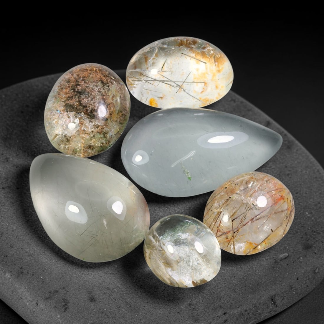 185.08ct Natural Brazilian Phantom Quartz Cabochon Parcel Lot, 68EW: This polished cabochon parcel of natural phantom quartz features transparent clear quartz host stone enclosing intricate internal phantom mineral deposits. Each oval cabochon displays unique scenic in