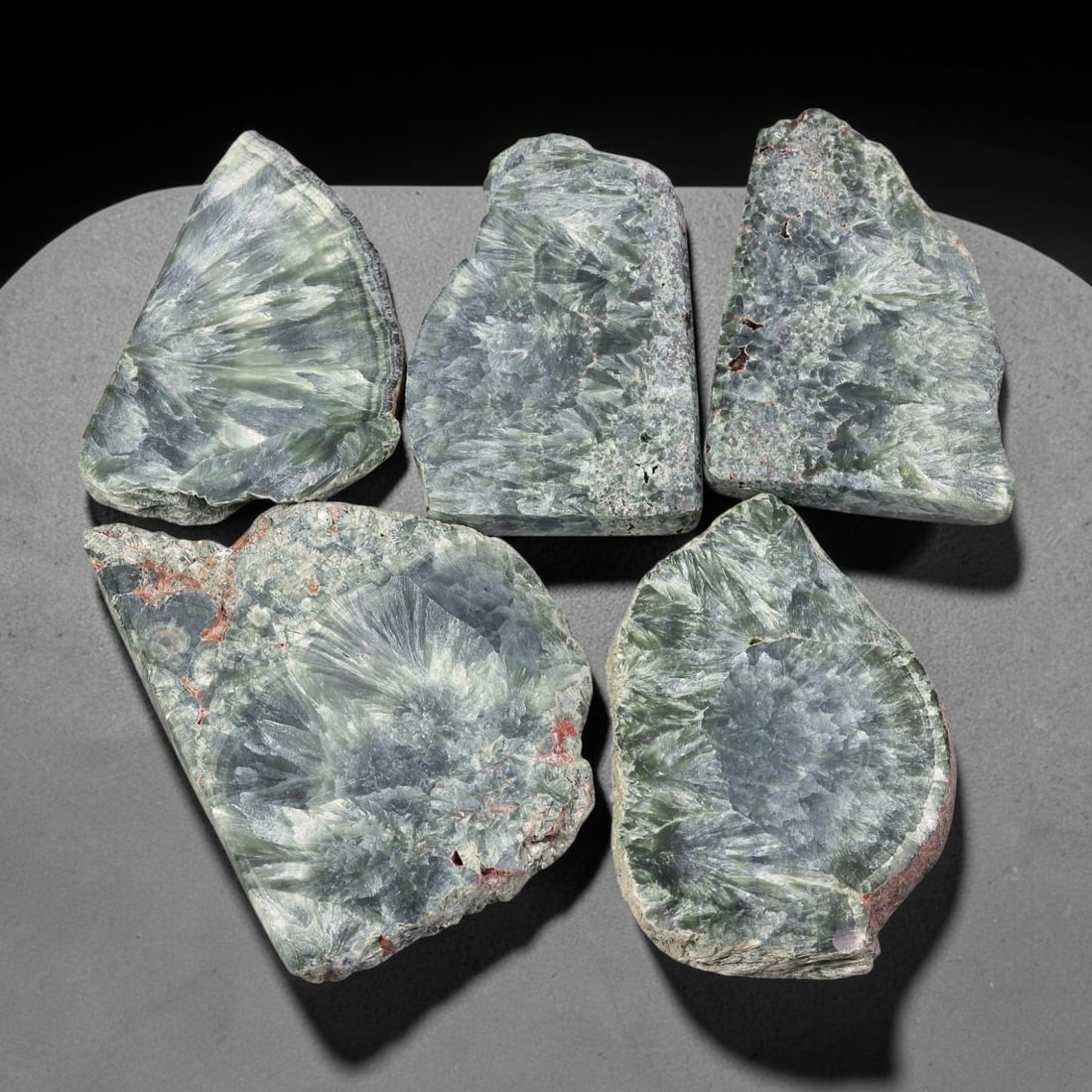 455ct Natural Siberian Seraphinite Rough Slab Parcel Lot, 78EX: This rough slab parcel showcases striking seraphinite specimens distinguished by signature feathery, fan-like silvery-green crystalline sprays across sawn surfaces. Deep forest-green matrix interweave