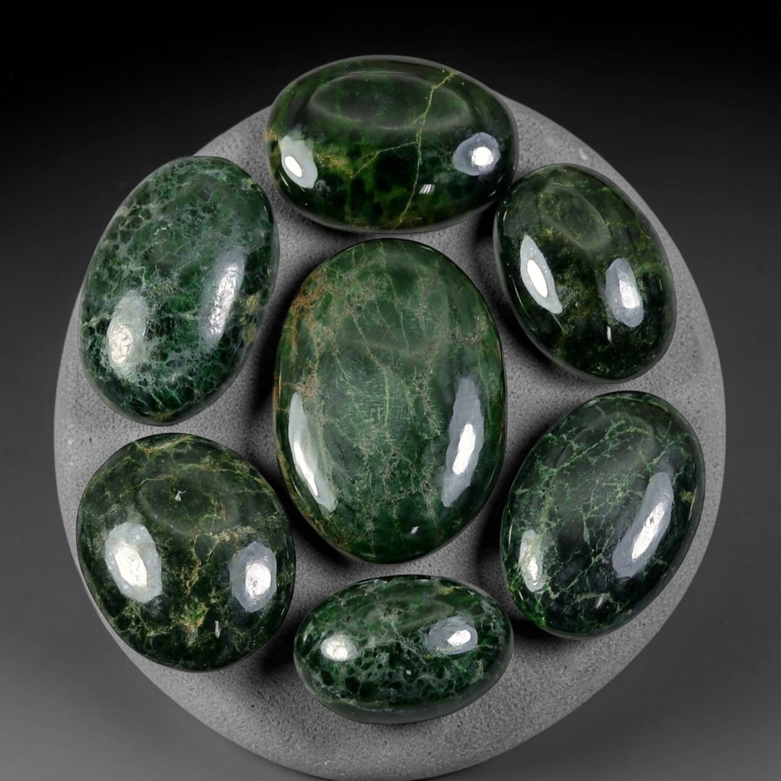 109.53ct Natural Burmese Type A Jadeite Jade Cabochon Parcel Lot, 99EY: This polished oval cabochon parcel displays natural Type A burmese jadeite jade with broad colour variation. High gloss polished domed surfaces reveal natural internal crystalline textures, mineral ve