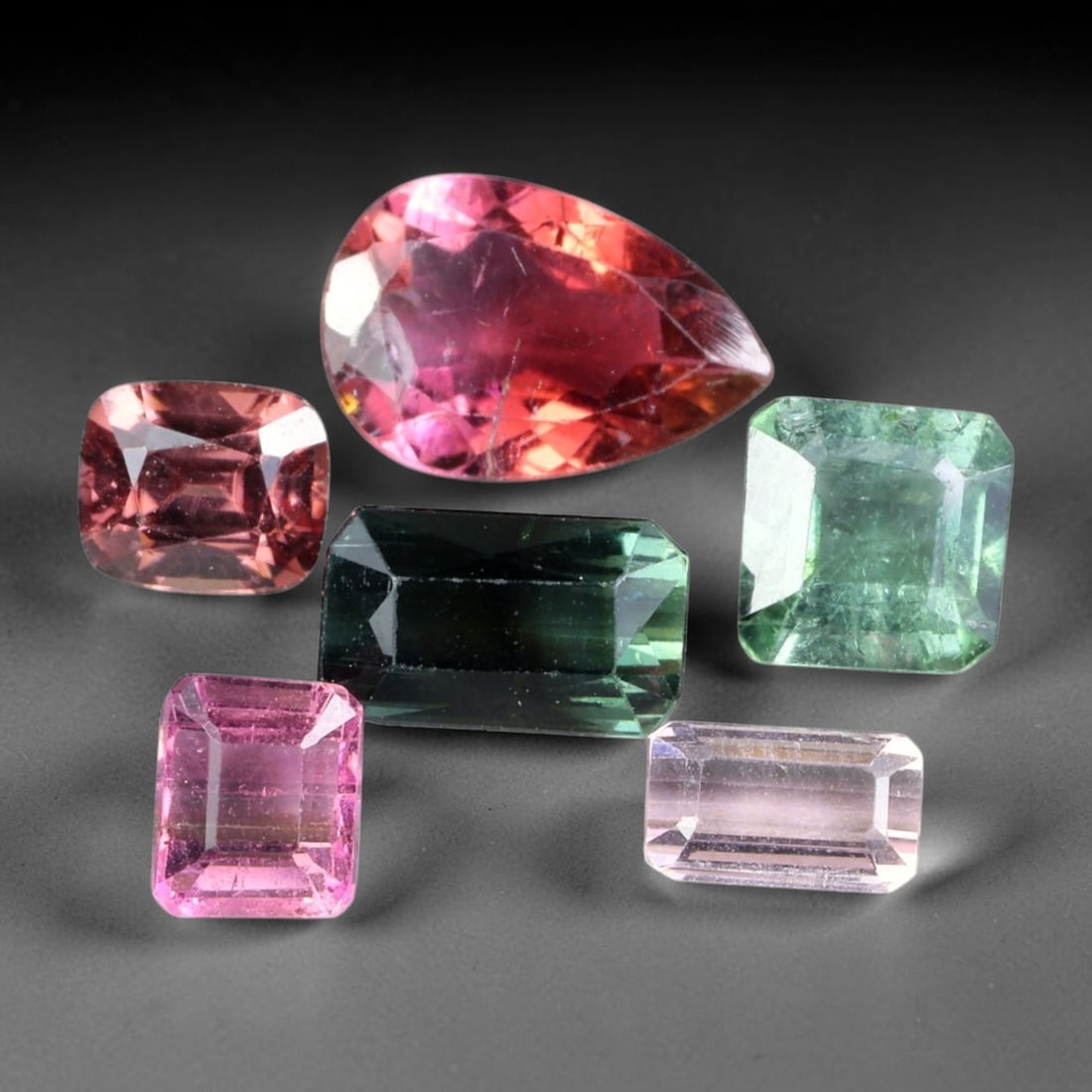 7.13ct Natural Mozambican Fancy Tourmaline Loose Gemstone Parcel Lot, 17EW: This colourful parcel of fancy tourmaline presents a vibrant spectrum of tones, including pastel mint-green, deep teal-blue, soft rose-pink and striking bi-colour saturation across mixed emerald-cut a