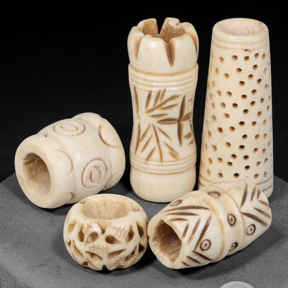 Antique Sino-Siberian Steppe Nomadic Stag Antler Carved Beads Parcel Lot, 27EY: Group of antique post-1850s Sino-Siberian steppe nomadic craft stag antler carved beads, each with fully drilled central bore for threading. Surfaces feature varied incised decorative motifs including