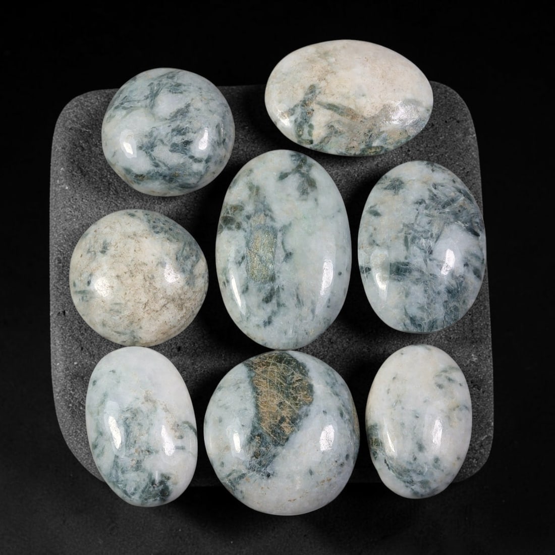 150.16ct Natural Burmese Type A Jadeite Jade Cabochon Parcel Lot, 94EY: This polished oval cabochon parcel displays natural Type A burmese jadeite jade with broad colour variation. High gloss polished domed surfaces reveal natural internal crystalline textures, mineral ve