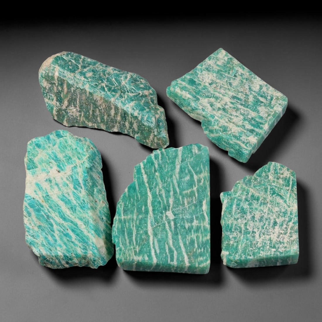 375ct Natural Russian Amazonite Slice Rough Parcel Lot, 68EX: This rough slice parcel displays striking teal-green amazonite interwoven with prominent creamy-white vein patterns across sawn flat surfaces. Each slice shows natural cleaving lines, crystalline text