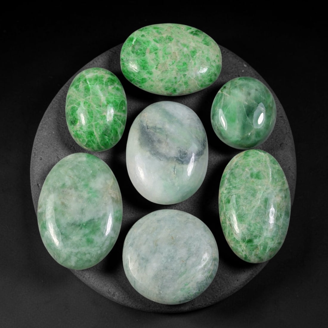 123.06ct Natural Burmese Type A Jadeite Jade Cabochon Parcel Lot, 95EY: This polished oval cabochon parcel displays natural Type A burmese jadeite jade with broad colour variation. High gloss polished domed surfaces reveal natural internal crystalline textures, mineral ve