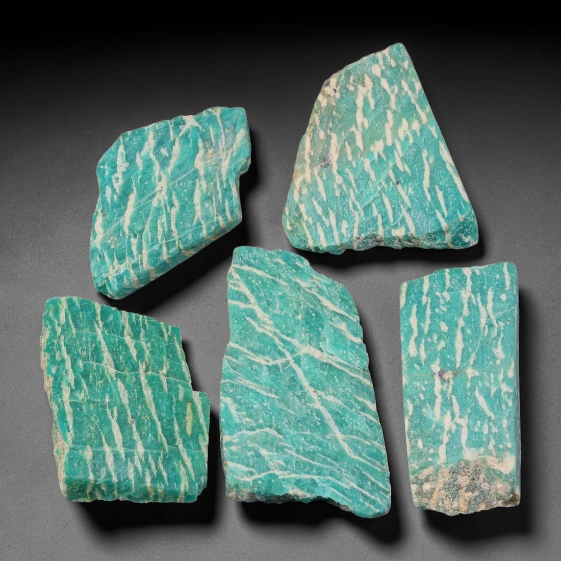 425ct Natural Russian Amazonite Slice Rough Parcel Lot, 69EX: This rough slice parcel displays striking teal-green amazonite interwoven with prominent creamy-white vein patterns across sawn flat surfaces. Each slice shows natural cleaving lines, crystalline text
