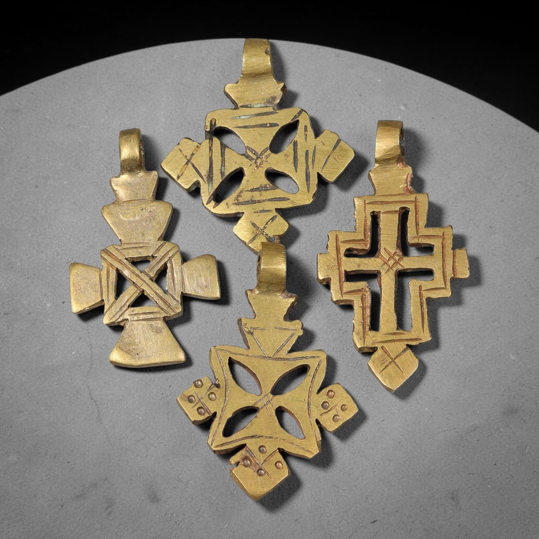 Vintage Coptic Ethiopian Christian Copper Alloy Cross Pendants Parcel Lot, 44BC: Group of vintage Coptic Ethiopian Christian pendants crafted from copper alloy, featuring varied cross-form silhouettes with hand-incised surface ornamentation and integrated suspension loops for wear