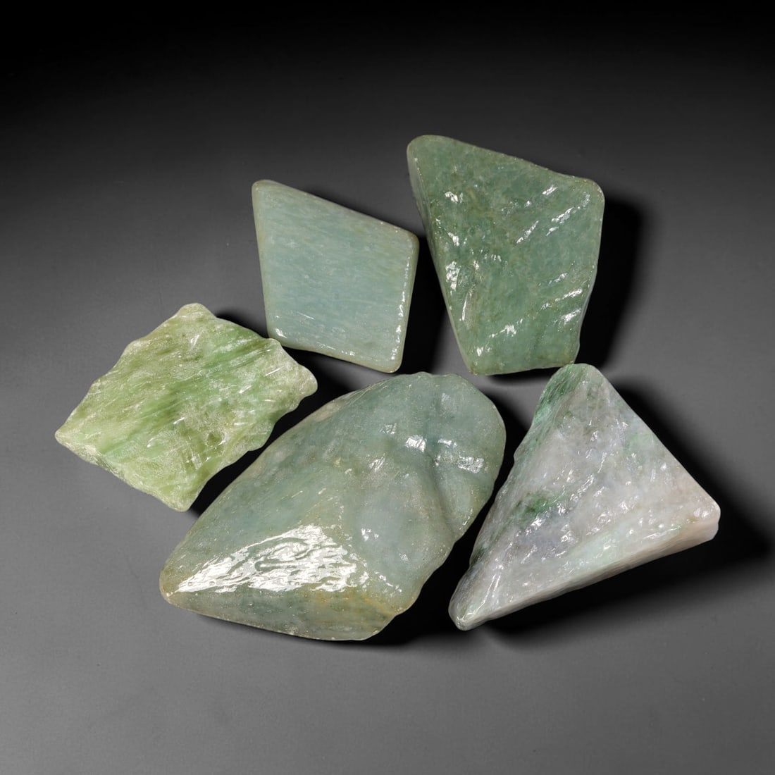 950ct Natural Burmese Type A Jadeite Jade Fully Polished Rough Parcel Lot, 29BC: This parcel features fully polished rough slabs of authentic Type A burmese jadeite jade, presenting mixed colour profiles including soft pale celadon-green, scattered vivid green patches, creamy whit
