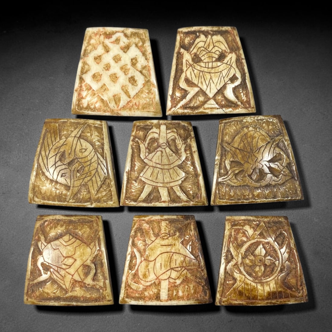 Antique Sino-Siberian Steppe Nomadic Stag Antler Carved Tablet Beads Parcel Lot, 23EY: Group of antique post-1850s Sino-Siberian steppe nomadic craft stag antler carved trapezoidal tablet beads, each with incised symbolic traditional motifs across front faces. Natural aged patina, surfa
