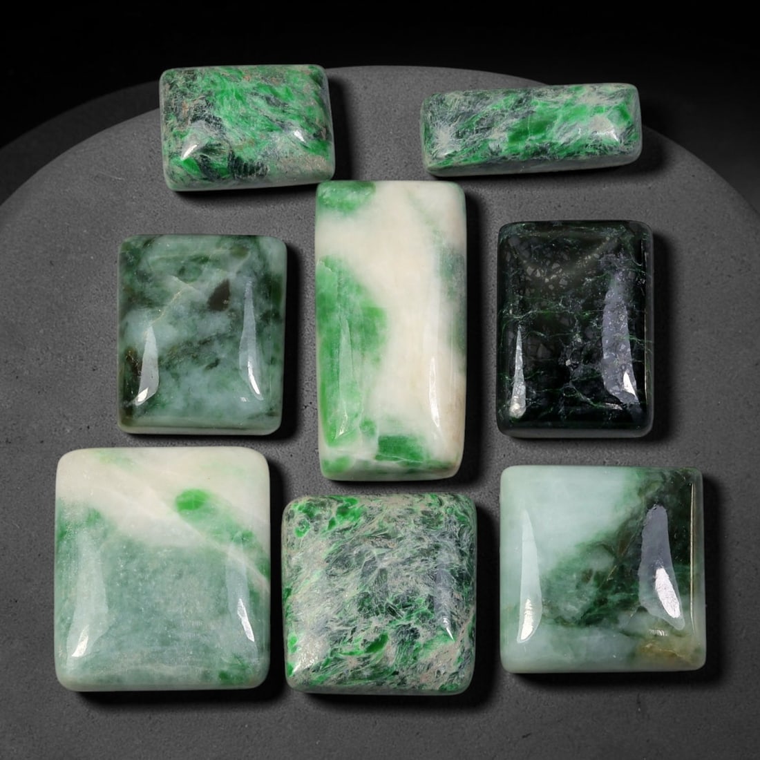 191.07ct Natural Burmese Type A Jadeite Jade Cabochon Parcel Lot, 92EY: This polished oval cabochon parcel displays natural Type A burmese jadeite jade with broad colour variation. High gloss polished domed surfaces reveal natural internal crystalline textures, mineral ve