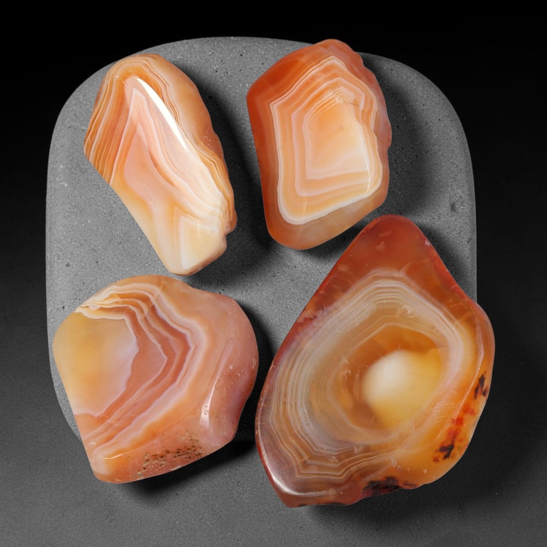290ct Natural Brazilian Carnelian Banded Agate Rough Slab Parcel Lot, 71EX: This rough slab parcel displays natural carnelian banded agate with distinct layered colour banding across the raw slab material. Warm orange-red carnelian zones alternate against milky translucent ag