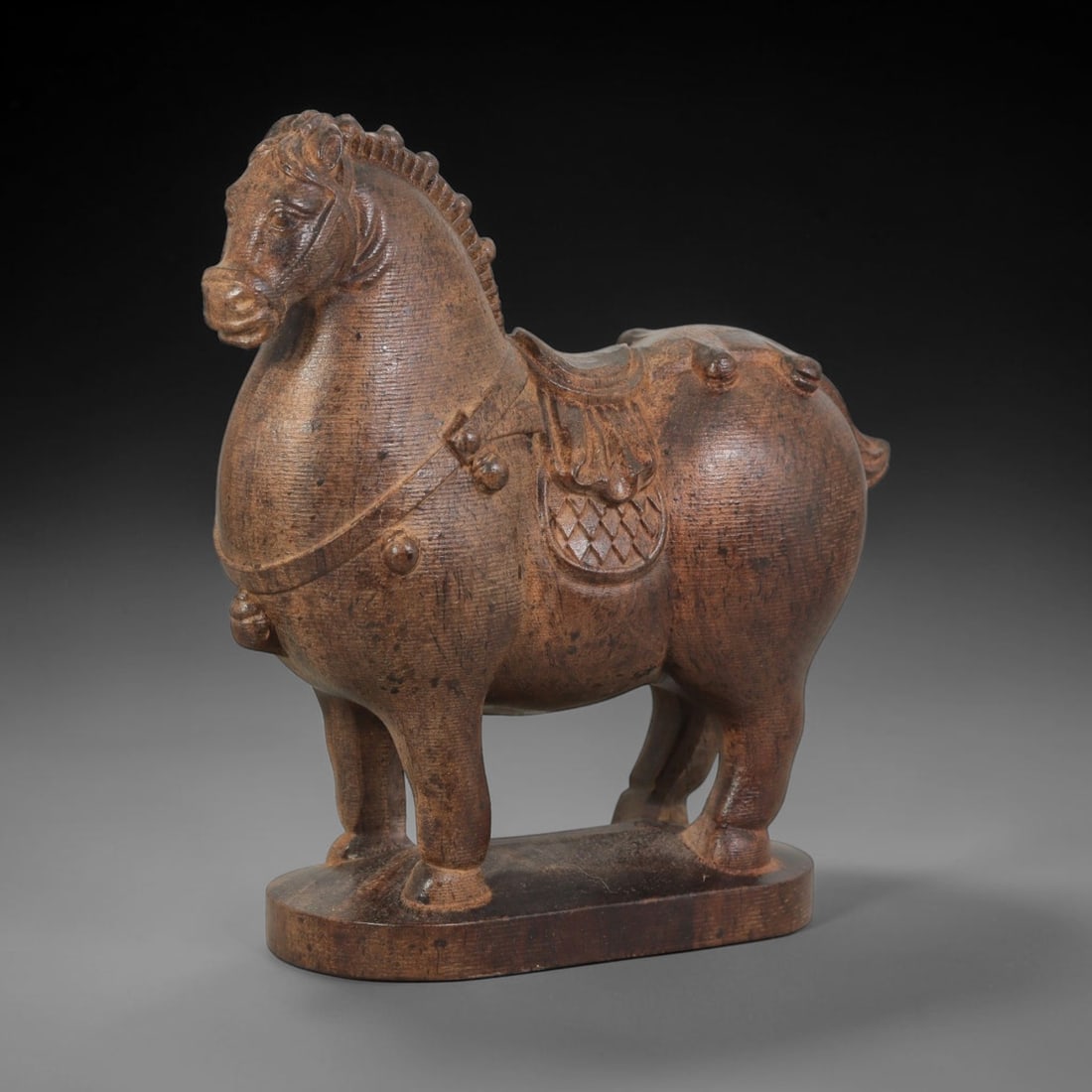 A Carved Agarwood Figure of a Horse Sculpture Figurine, 9AD: Carved from fragrant agarwood (Aquilaria spp.), the work depicts a horse in a robust and plump form, standing with raised head and regular tooth-like ridges along the mane. The body is carved with a s