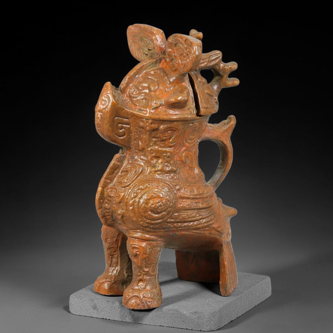 A Chinese Bronze Figural Bird-Form Lidded Censer, 62AD: Cast in bronze, this compact censer is modelled in the form of a stylized composite bird creature standing upon detailed decorated legs. The removable lidded head section forms the cover, while the bo