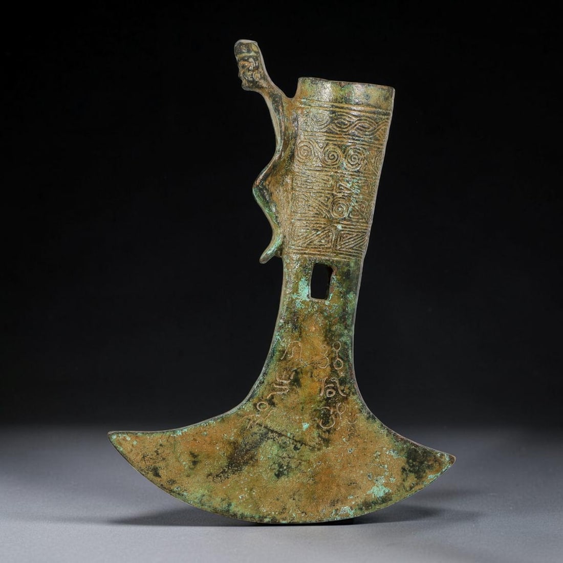A Chinese Archaic-Style Bronze Axe with Figural Finial and Inscribed Blade, 99AD (1 of 3)