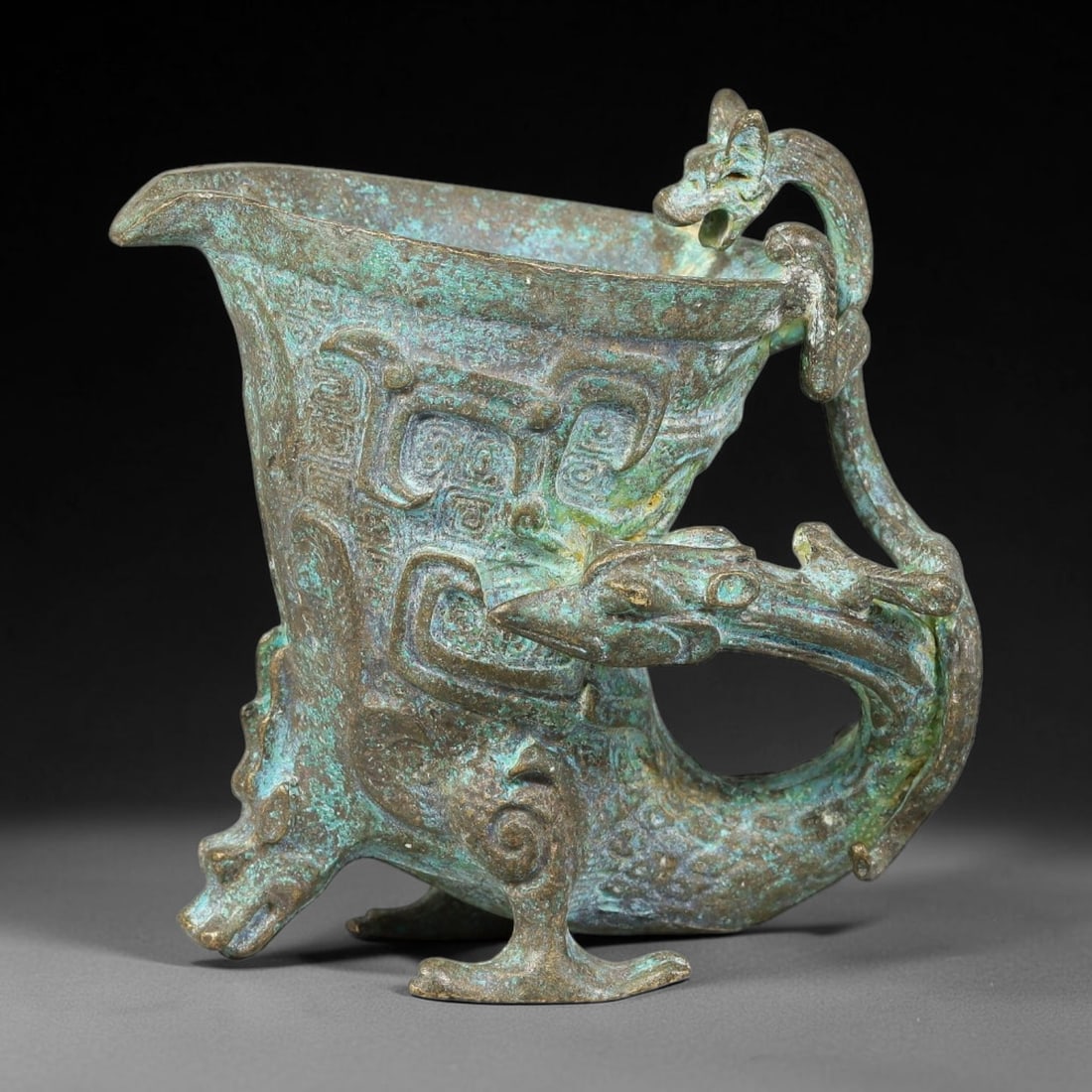 A Chinese Archaic-Style Bronze Phoenix-Supported Libation Vessel, 74AD (1 of 3)