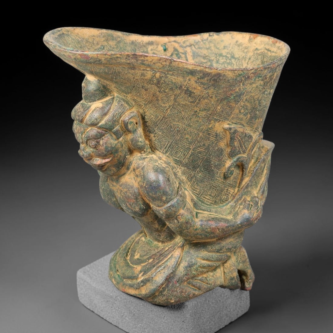 A Chinese Archaic-Style Bronze Rhyton Vessel with Kneeling Guardian Figure, 78AD (1 of 3)