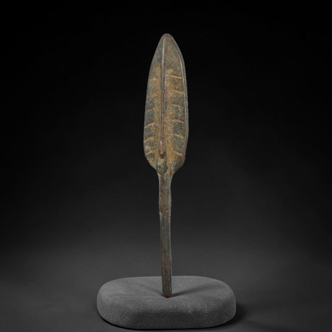 Ancient Chinese Warring-States Period Bronze Arrowhead (475-221 BCE), 6AJ: Authentic excavated bronze arrowhead from Warring-States China, featuring leaf-shaped blade decorated with incised linear ornamentation on each face, raised central rib, and long solid tang for haftin