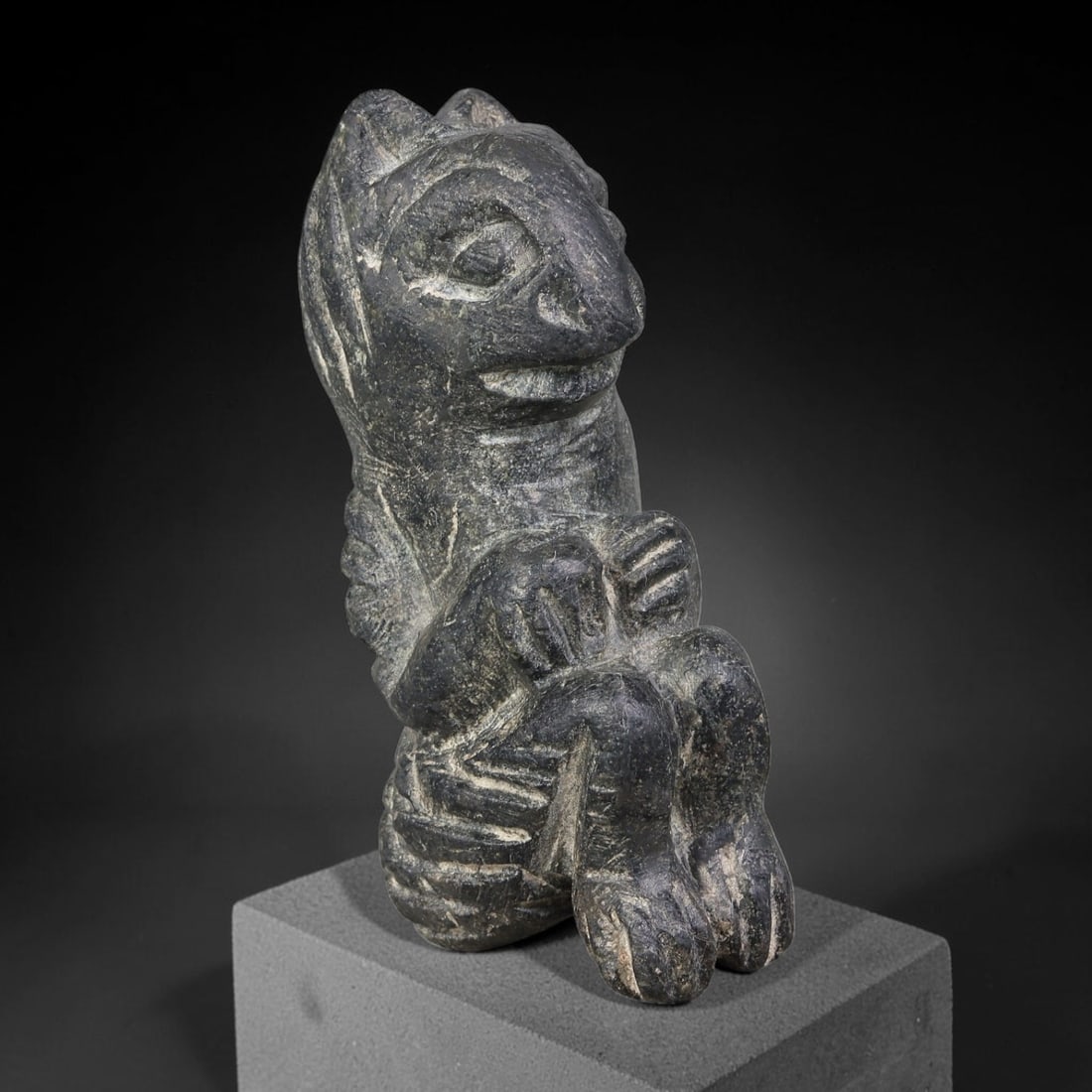 Ancient Sasanian Persian Schist Composite Anthropomorphic-Zoomorphic Figurine (224-651 CE), 48AJ: Dark schist carved compact seated composite figurine blending human and animalistic features, representative of Sasanian Persian folk talismanic carving tradition. Incised detailing defines facial att
