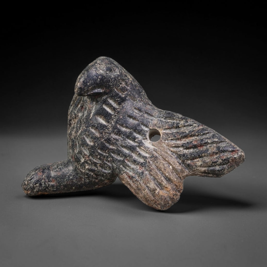Ancient Sasanian Persian Schist Bird Amulet (224-651 CE), 19AK: This carved schist bird-form amulet originates from the Sasanian Persian Empire, crafted as a protective zoomorphic talisman aligned with Zoroastrian ritual traditions of late antiquity. Fine incised 