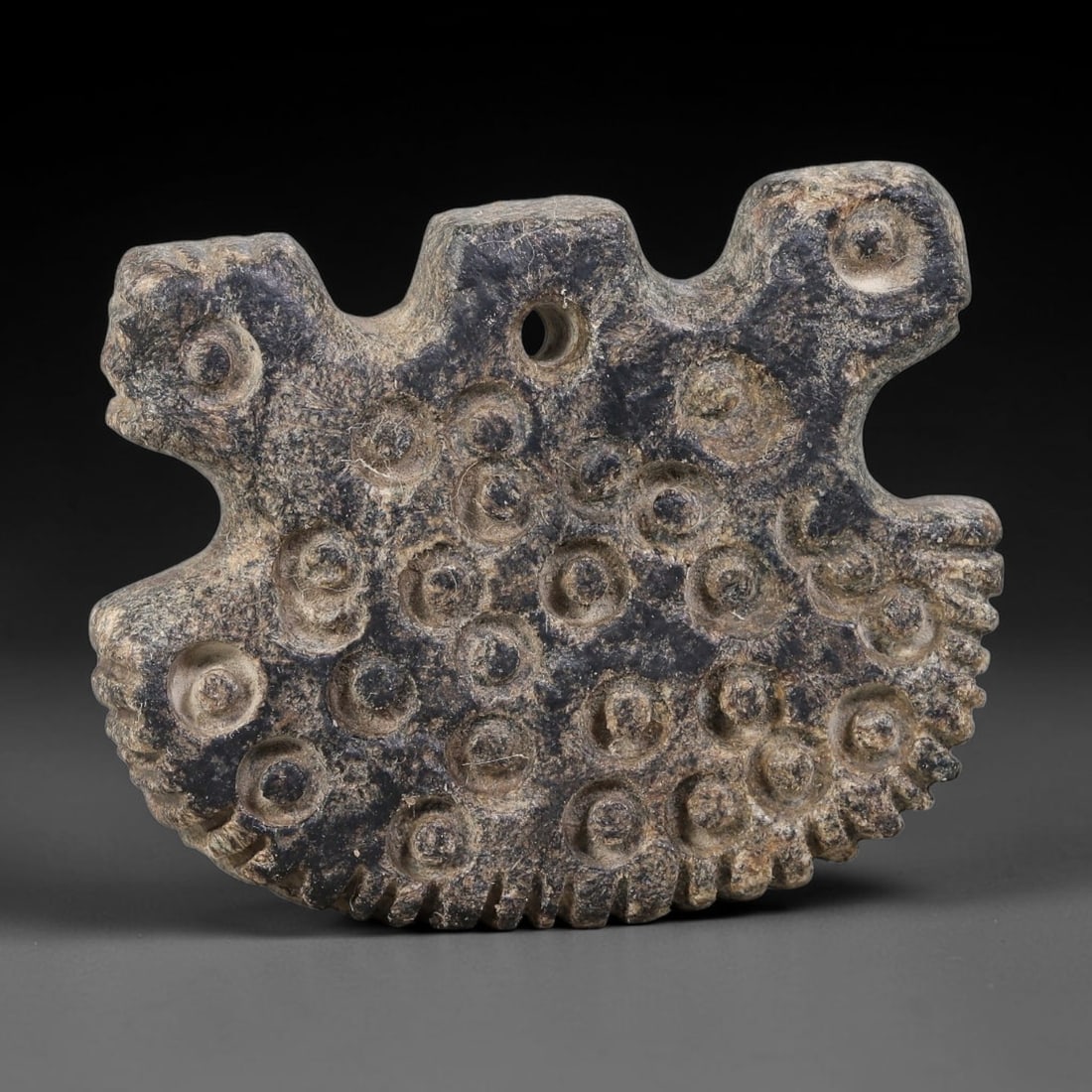 Ancient Ubaid-Mesopotamian Multi-Head Zoomorphic Stone Pendant Amulet (4500-3500 BCE), 88AJ: This ancient multi-head zoomorphic stone pendant amulet originates from Ubaid-Mesopotamian cultural sphere, serving as a potent wearable apotropaic ritual ornament. The flat-form pendant bears multipl
